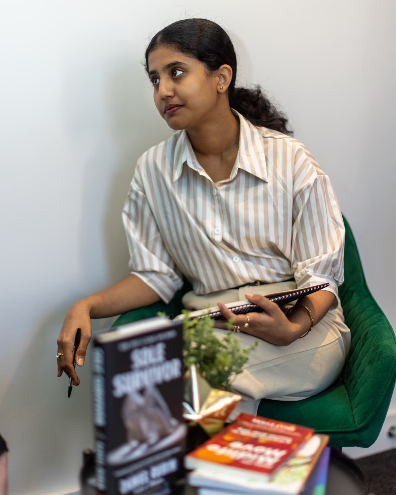 A private planning session at Brandspire, with a stack of published client books close by